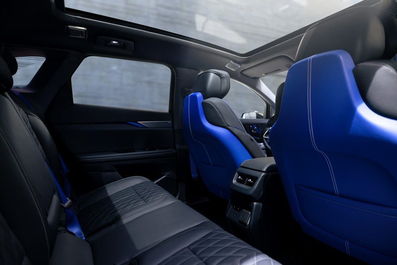 Back Seat View of the 2026 OPTIQ-V Blue Front Seats, Sun Roof, and Interior | Braden Cadillac in CARROLL OH
